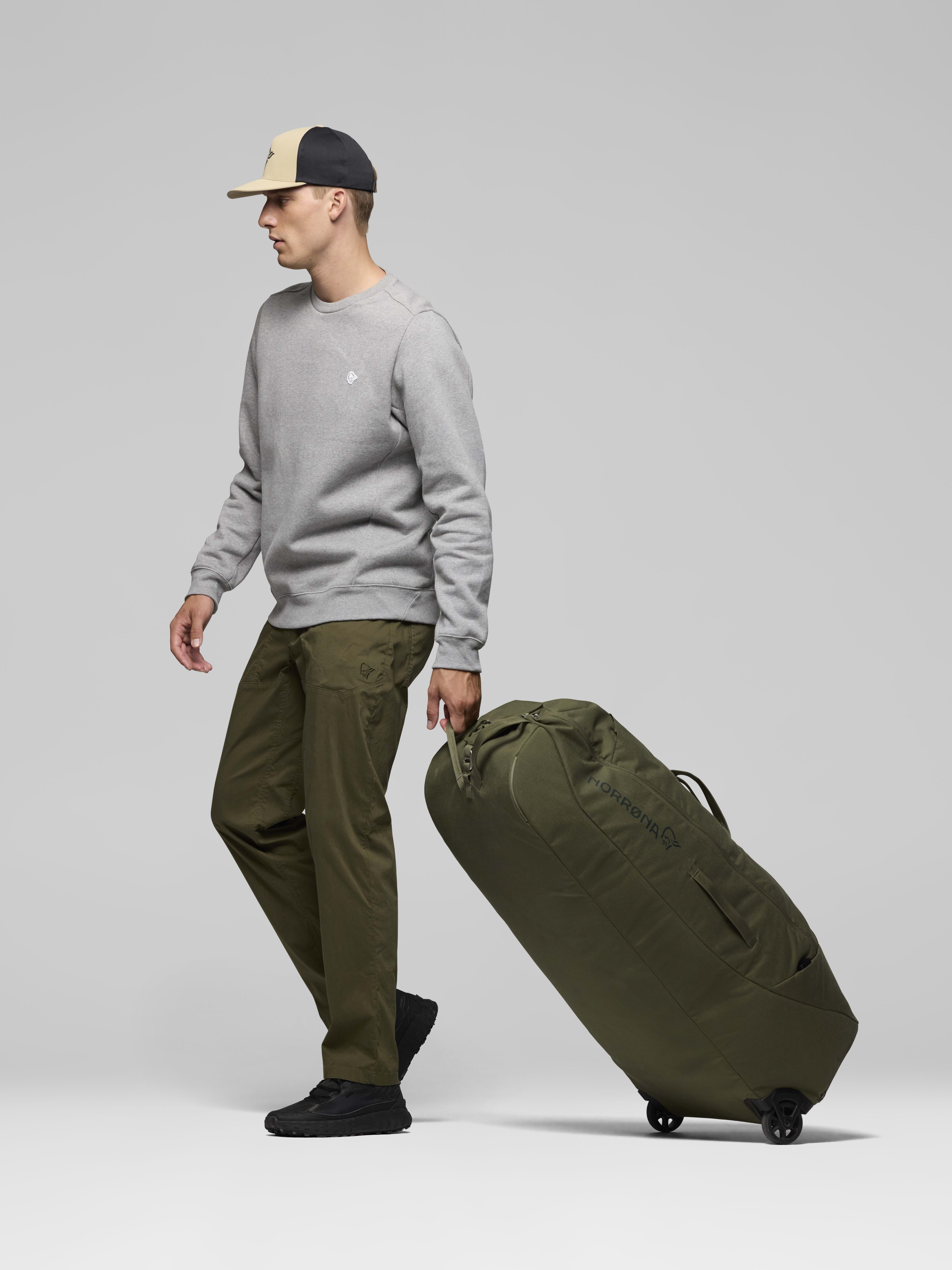 Female Look side image of norrona 120L Trolley Bag Olive Night