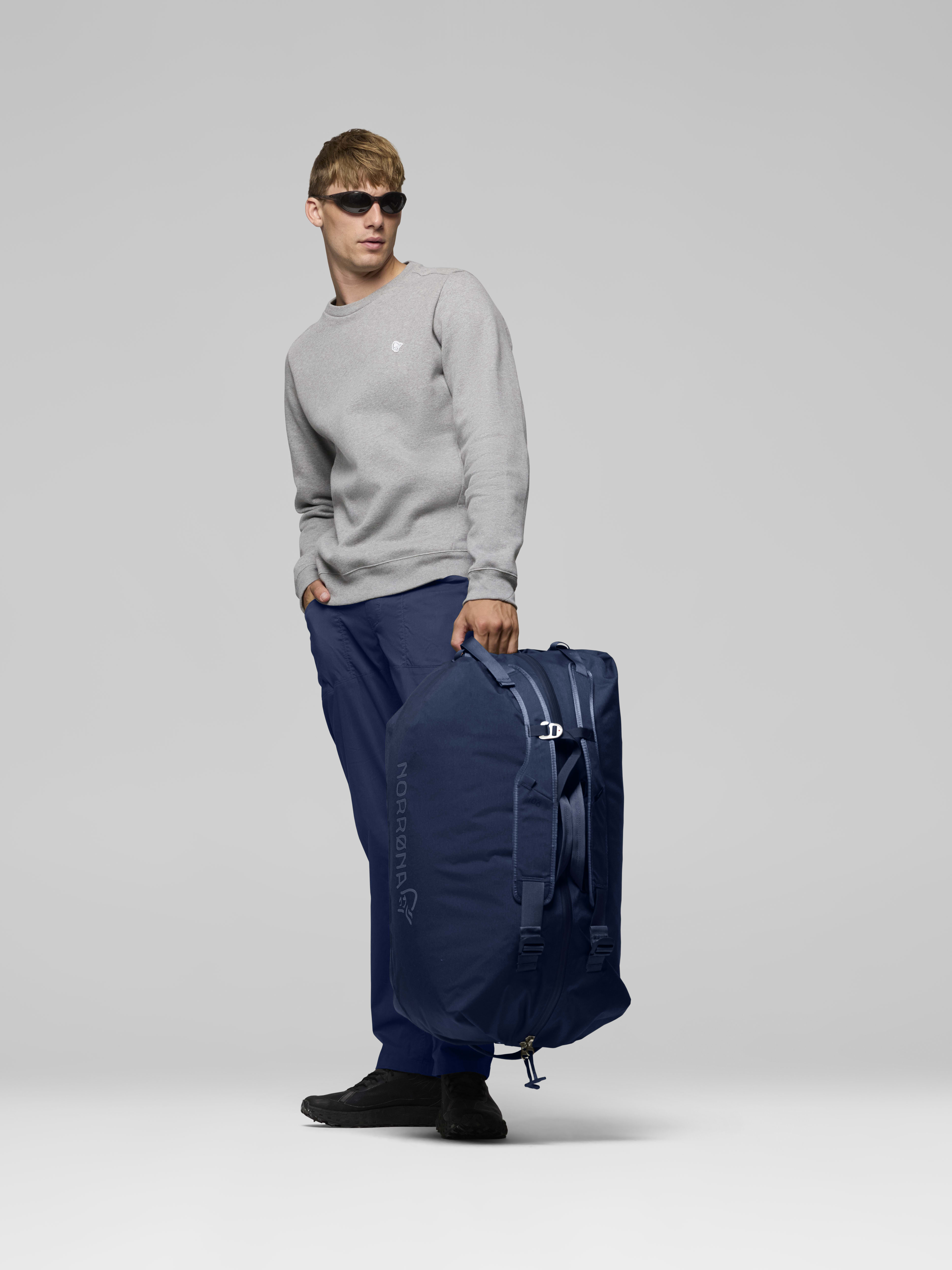 Female Look side image of norrona 90L Duffel Bag Indigo Night