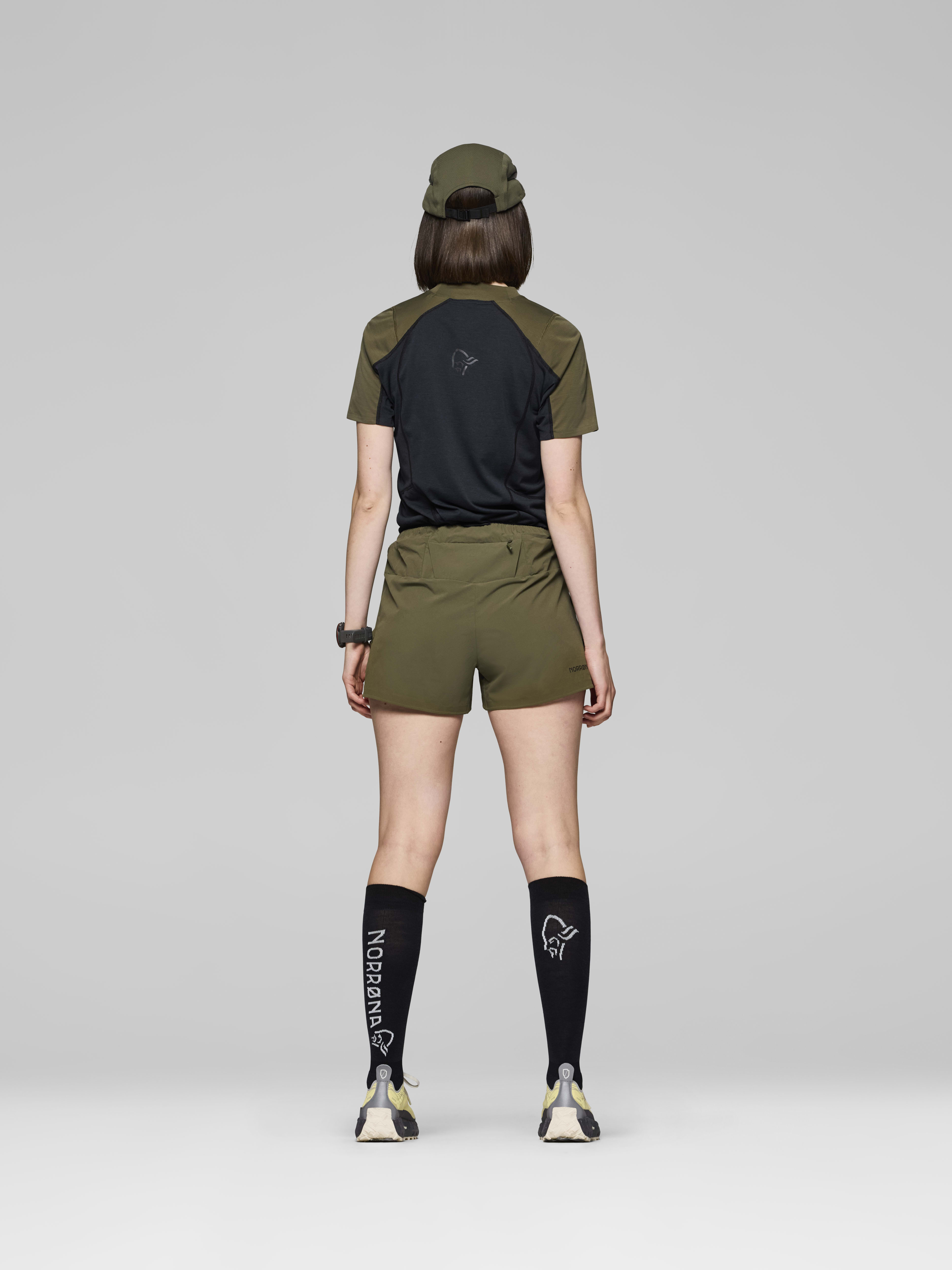 Female Look back image of senja flex1 4" Shorts Olive Night