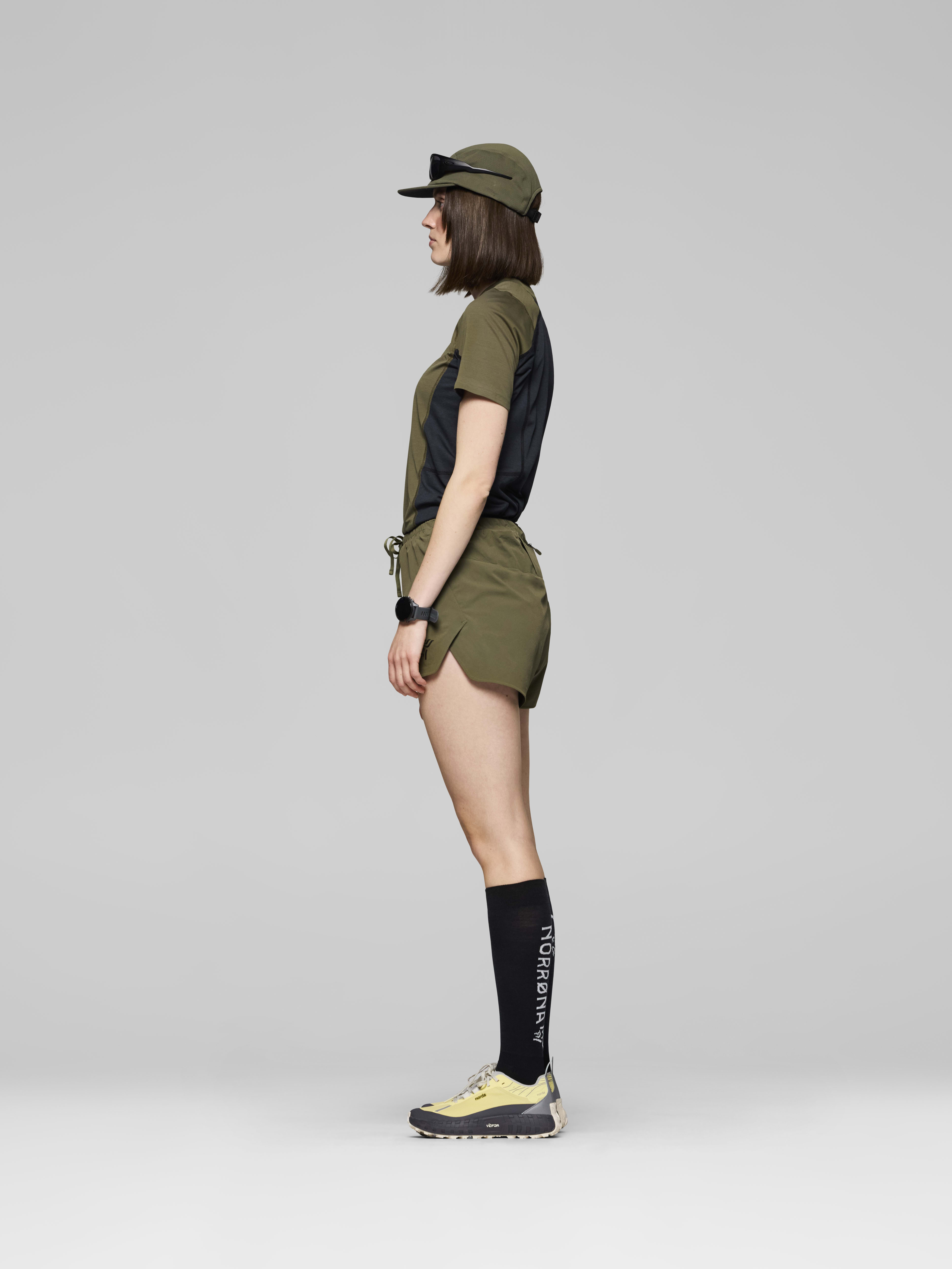 Female Look side image of senja flex1 4" Shorts Olive Night