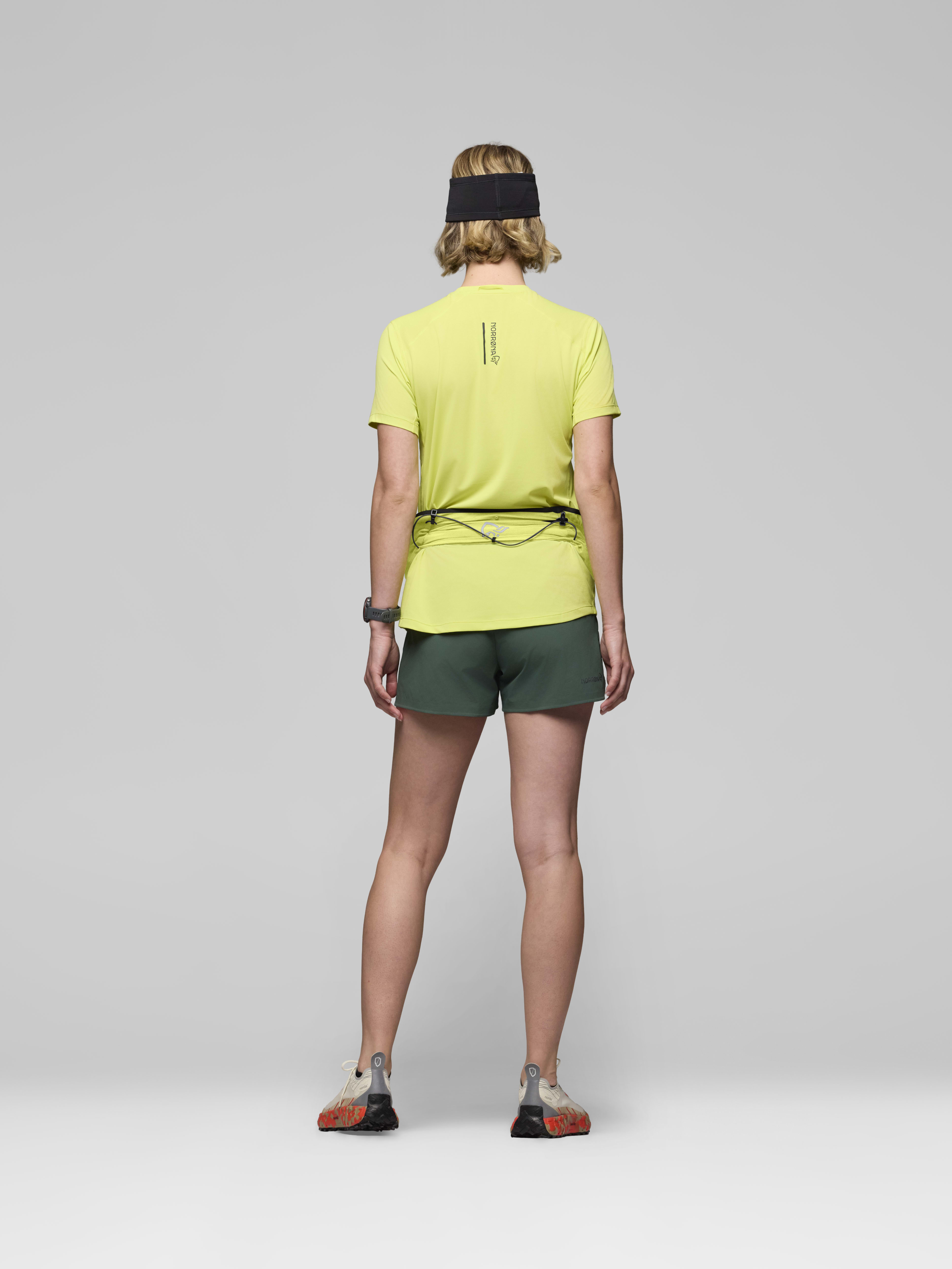 Female Look back image of senja equaliser stretch mesh Belt Limeade