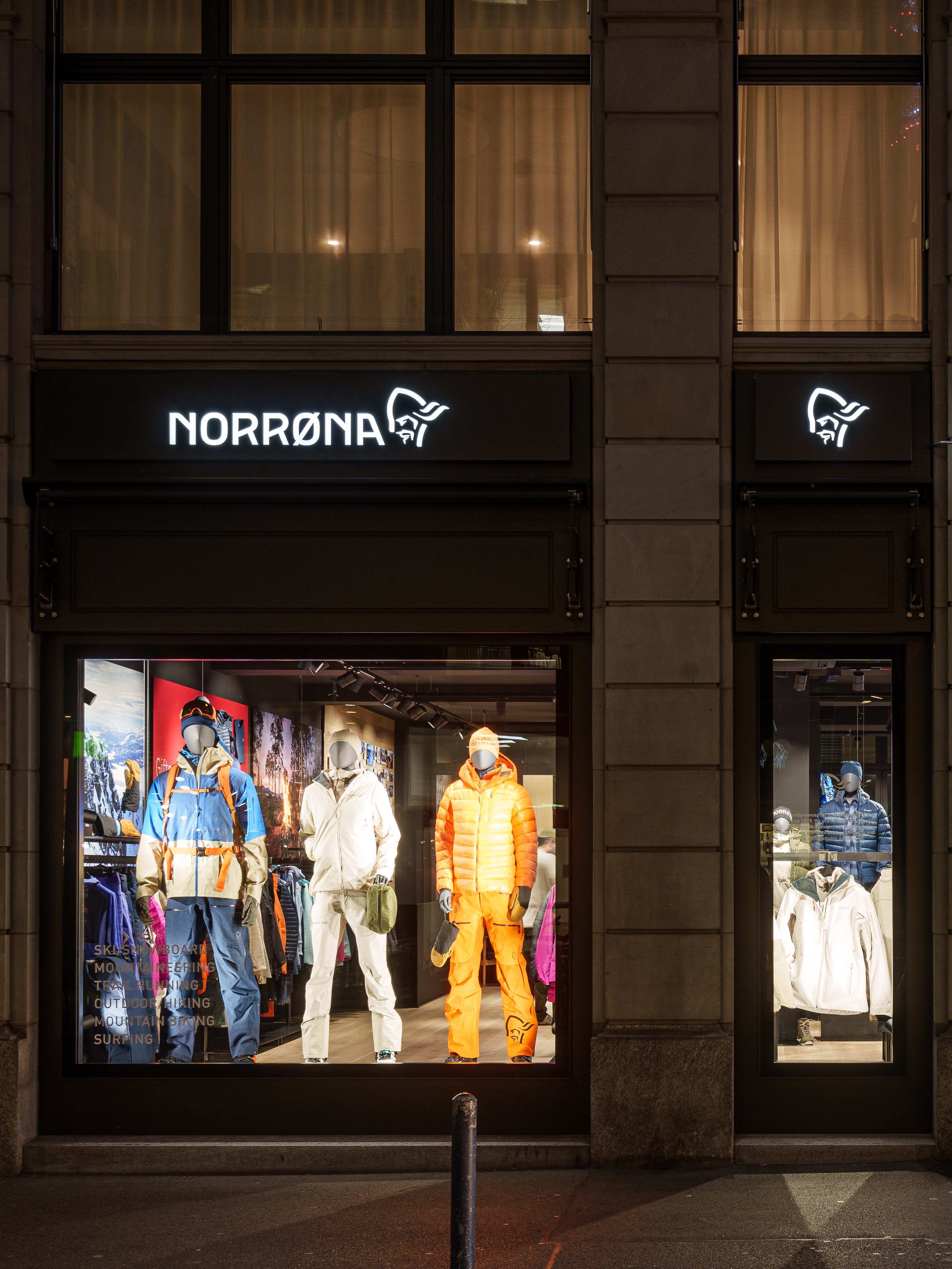 A storefront for a Norrøna store, with mannequins wearing Norrøna clothing in the window display.  
