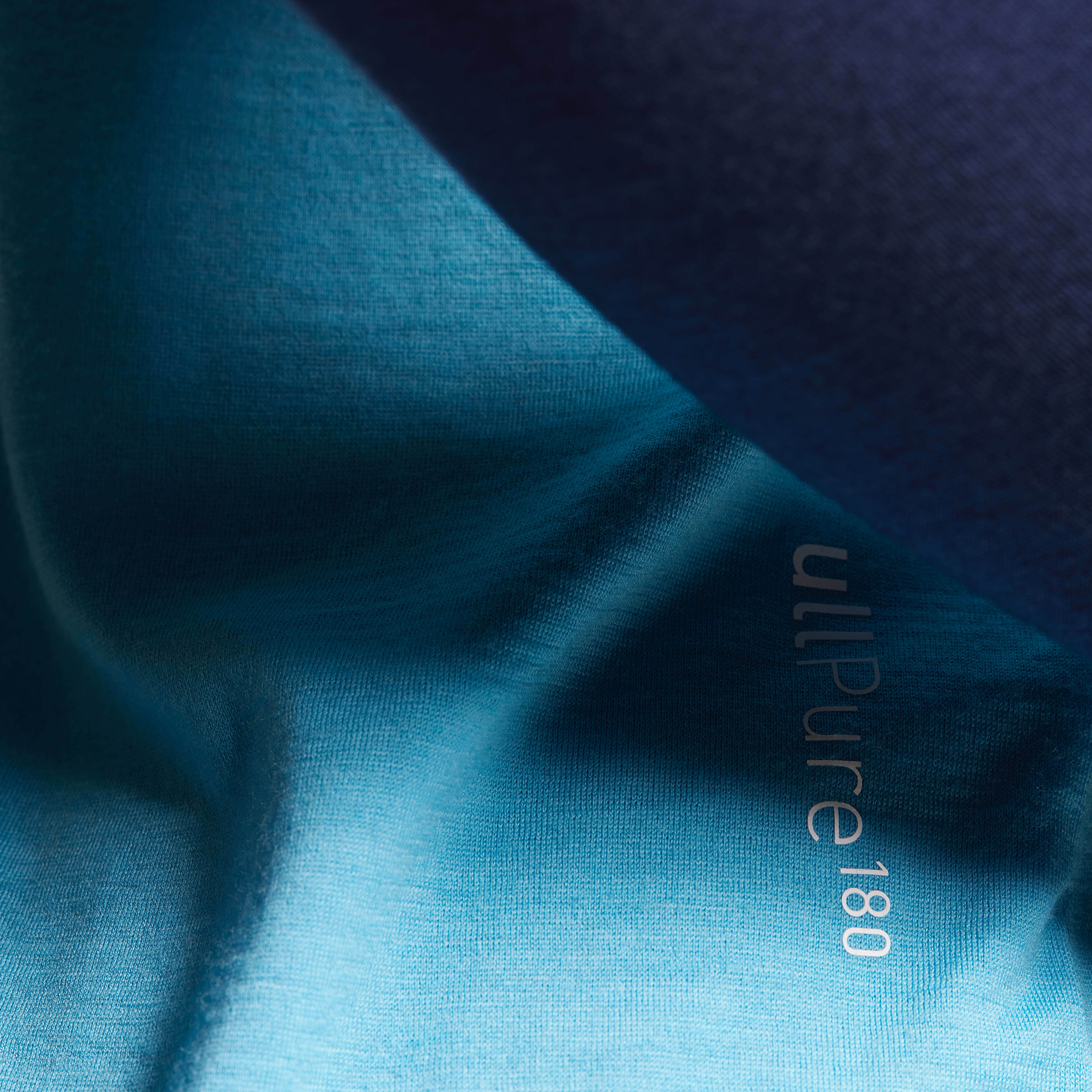Closeup of a blue Norrøna UltiPure 180 shirt. 
