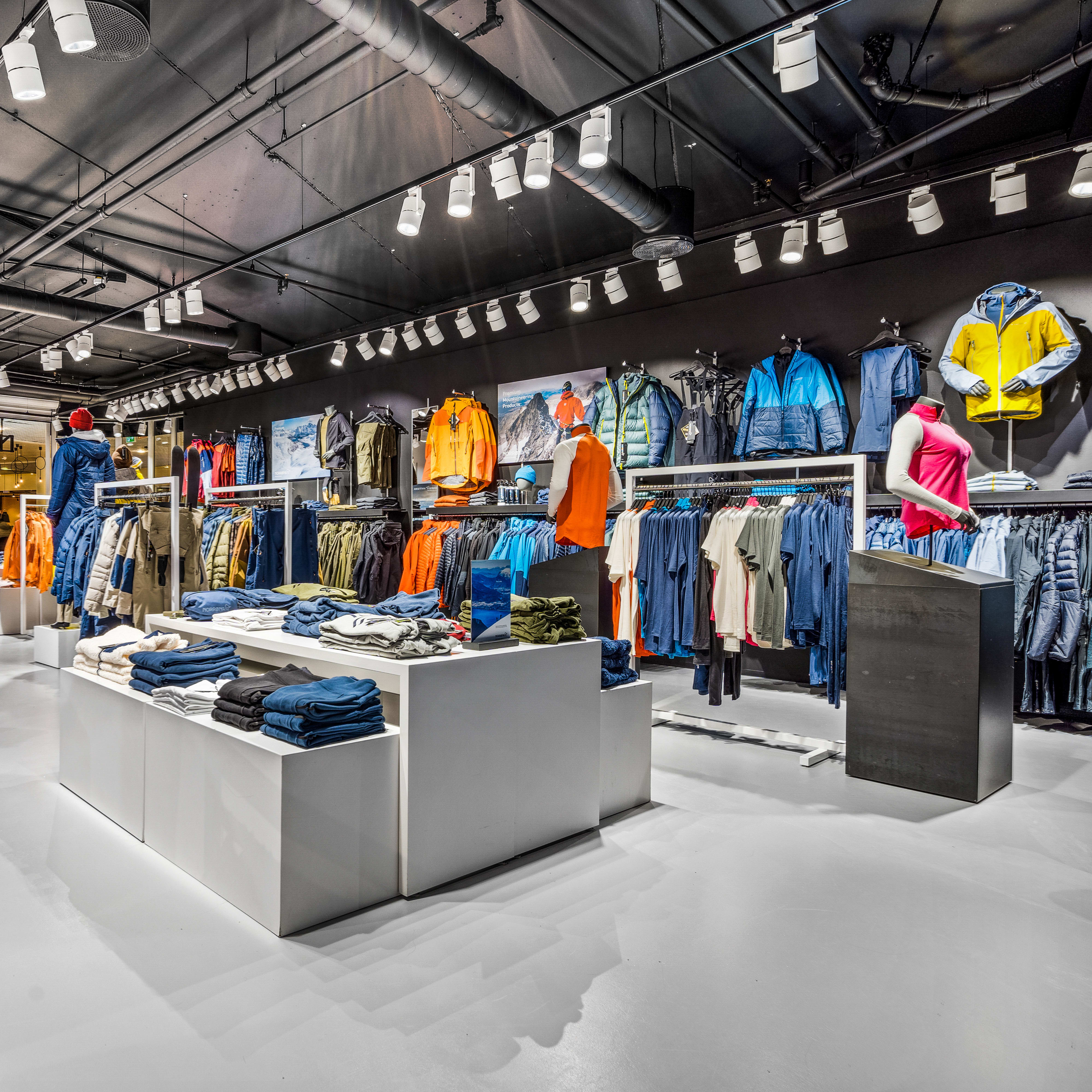Norrøna retail store interior displaying colorful outdoor apparel, jackets, and sleeping bags.