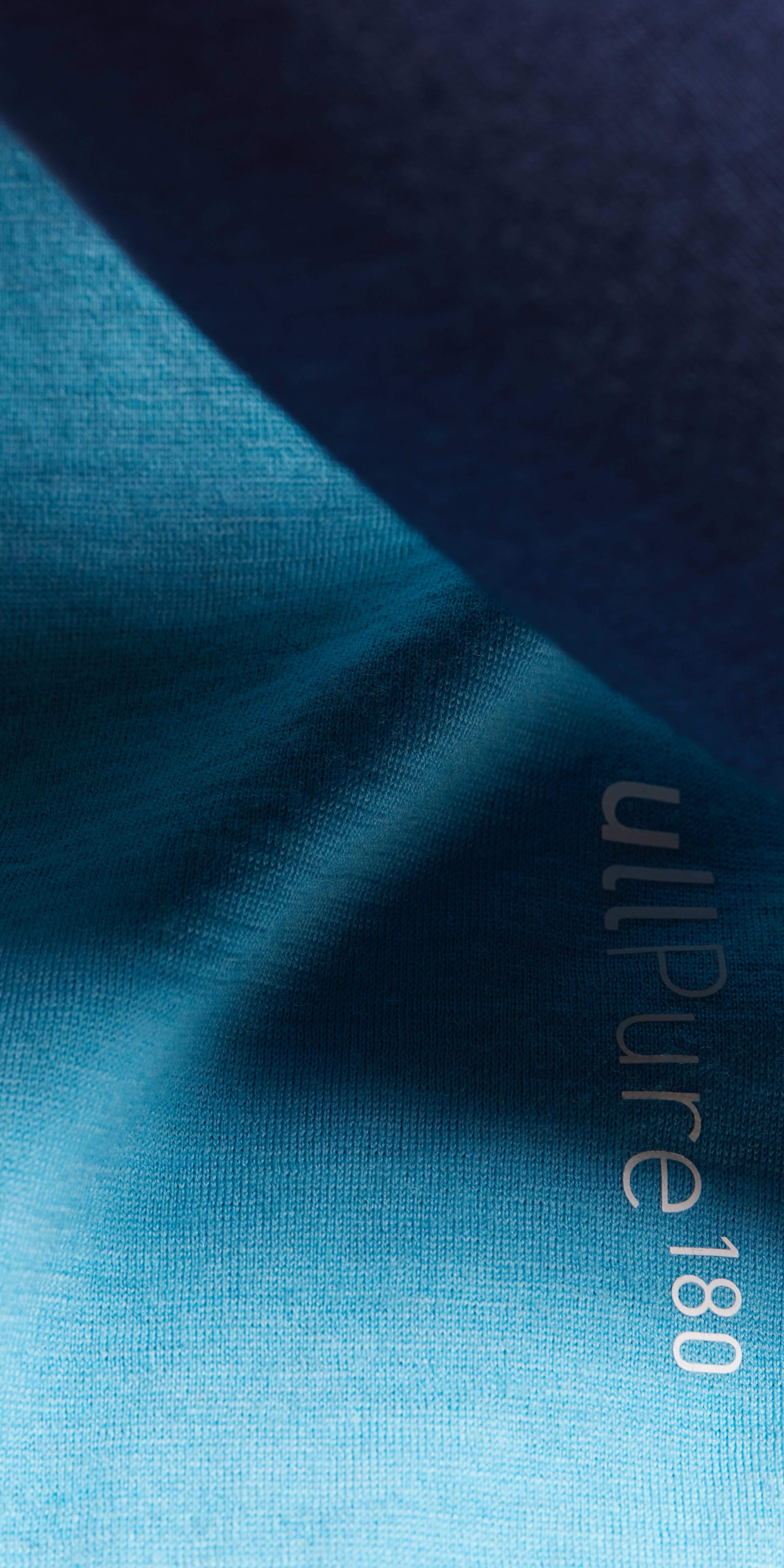 Closeup of a blue Norrøna UltiPure 180 shirt.
