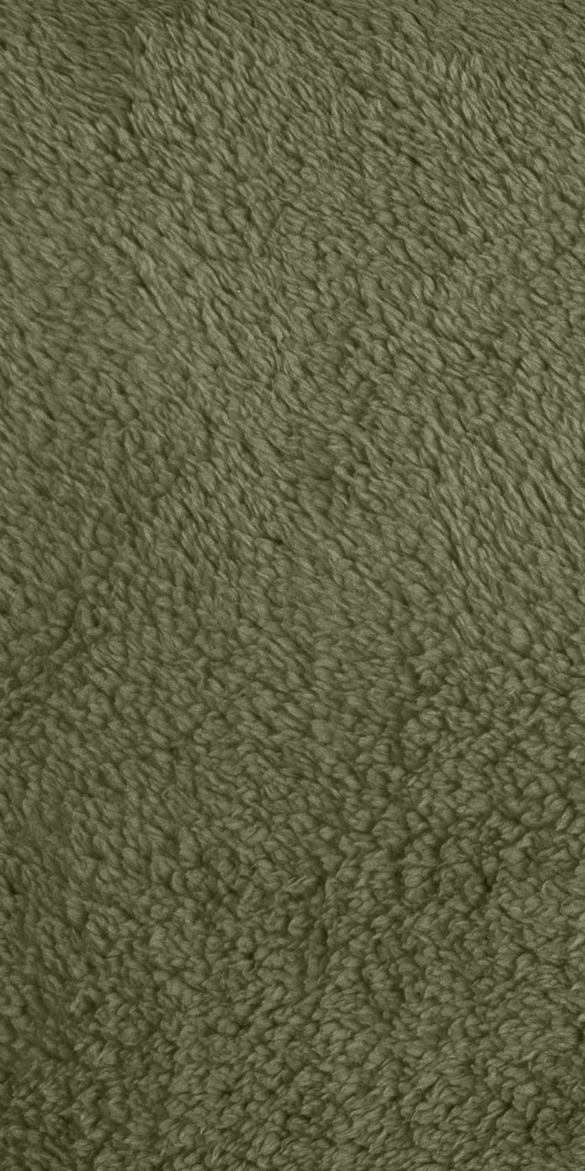 Close-up of a green, fuzzy Norrøna fleece fabric. 
