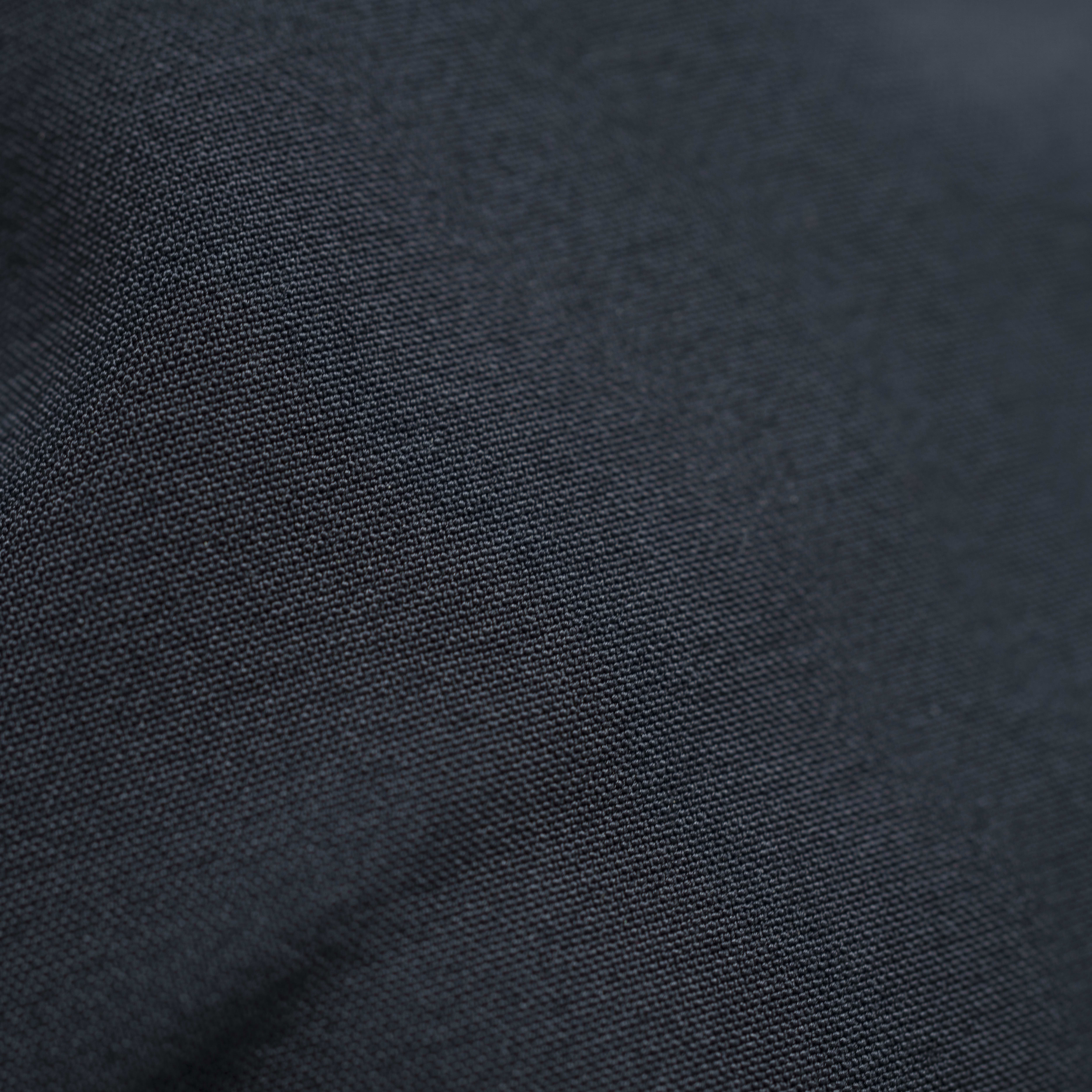 Close-up of the texture of a dark Norrøna fabric. 
