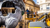 Plantá - a worker setting up falla in Plaza de Ayuntamiento - Fallas Valencia