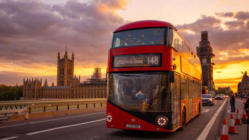 London bus with Westminster Palace in the background