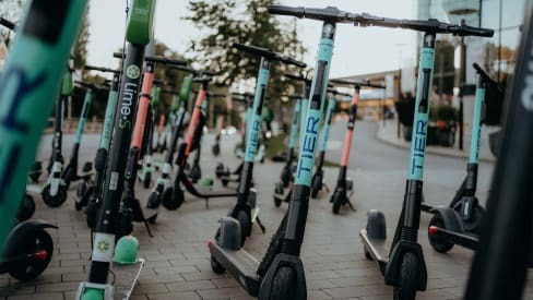 Tier electric scooters parked