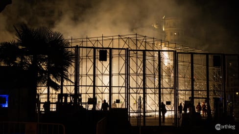 People in cage throwing firecrackers during Corda in Valencian Fallas