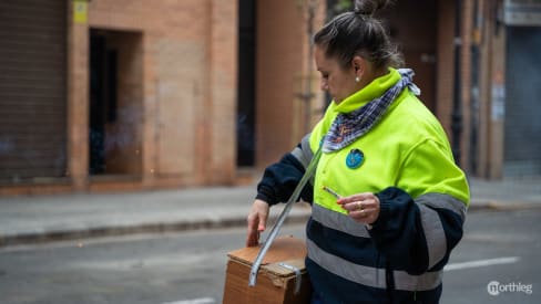 Fallera with box of firecrackers in Desperta in Valencia