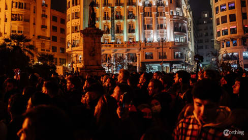 Crowd watching burning of a falla during fallas in Valencia