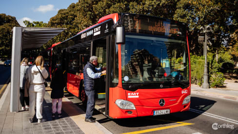 People getting on a bus in Valencia