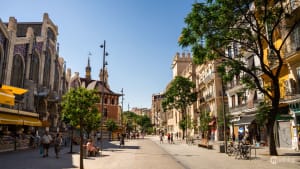 Interior view of Valencia's historic El Mercat market with traditional food stalls and architectural details