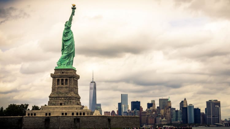 New York’s cityscape behind the Statue of LIberty