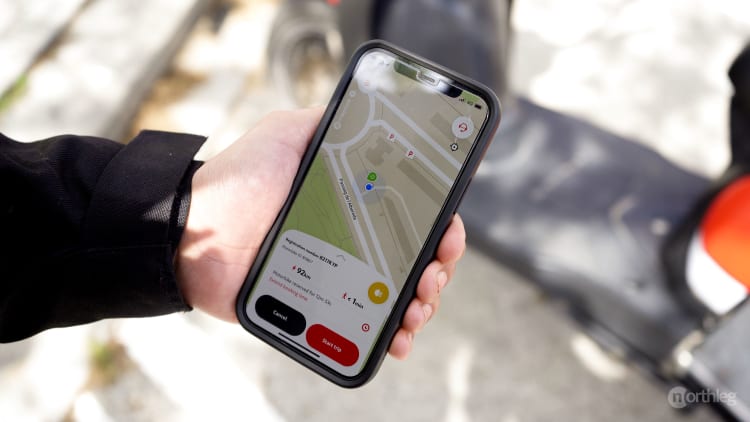 Smartphone screen displaying a map with nearby electric scooter rental locations in Valencia, showing a scooter just 92m away.