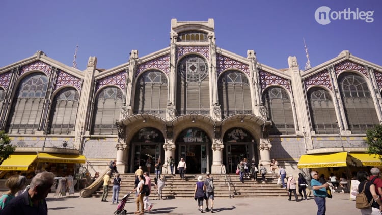 Exterior view of Valencia's Central Market with ornate architectural details and decorative facade