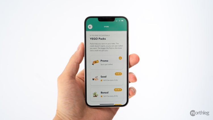 Smartphone screen displaying YEGO scooter rental pricing packs with different credit options