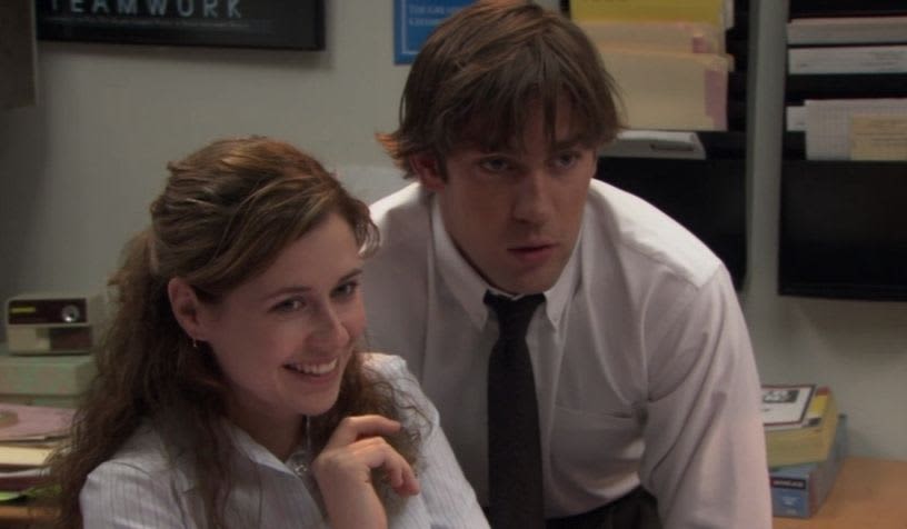 jim and pam at the reception smiling