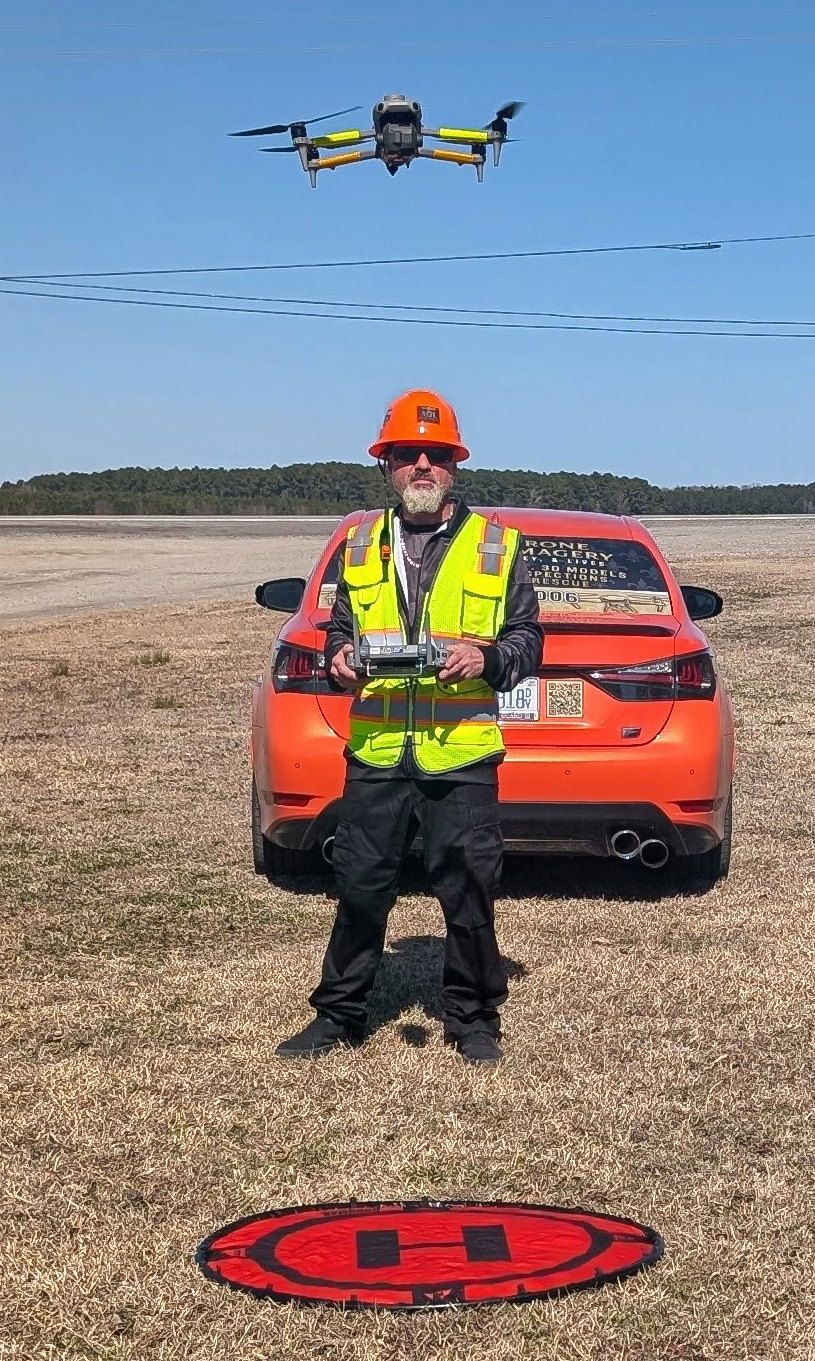 Dominick Schilleci operating a drone in the field for AGL Drone Imagery