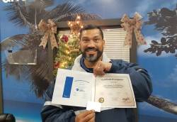 Edric Diaz, lead maintenance worker at City of Sanford, proudly holding two certifications. Photo courtesy of Robert Beall.