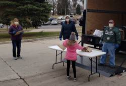 Kathy Kline, director of Morgan Grove Family Center, serving meals to center participants during COVID-19. Photo courtesy of Shelly Strasser.