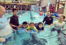 Rebecca Moore (second from right), manager of summer day camp and outreach for Northern Illinois Special Recreation Association, helping teach swim lessons. Photo courtesy of James Wiseman.