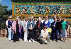 Tricia Schwall (front, kneeling), program manager for Dickinson Hall-Lake Forest Lake Bluff Senior Center, with program participants in Chicago's Chinatown. Photo courtesy of Tara Purtell.