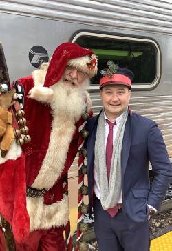 David Mohr (right), executive director at Lindenhurst Park District, as the conductor for the Sleigh Bell Express train ride. Photo courtesy of Kristi Murray.