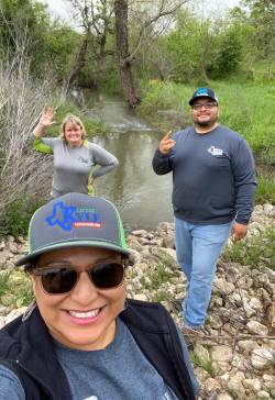Mariana Espinoza (front), director of City of Kyle Parks and Recreation, working to complete construction of Plum Creek Trail. Photo courtesy of Mariana Espinoza.