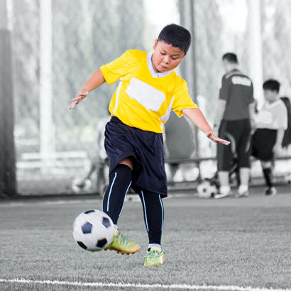 boy playing soccer 410