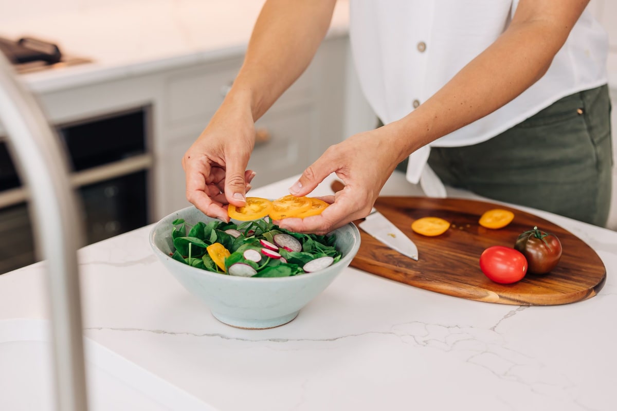 Dishes on a white marble counter top in a Modern style kitchen