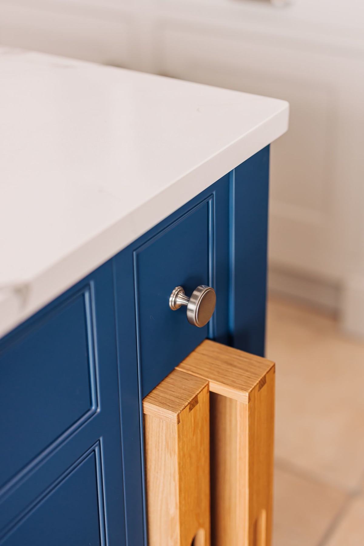 Tray inserts in a blue shaker kitchen