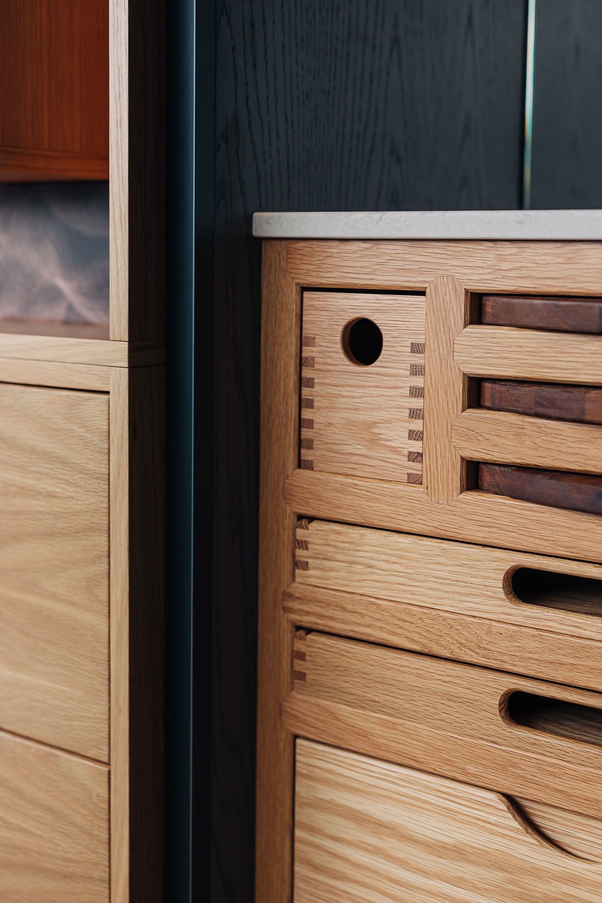 An inframe shaker drawer open and displaying its walnut interior