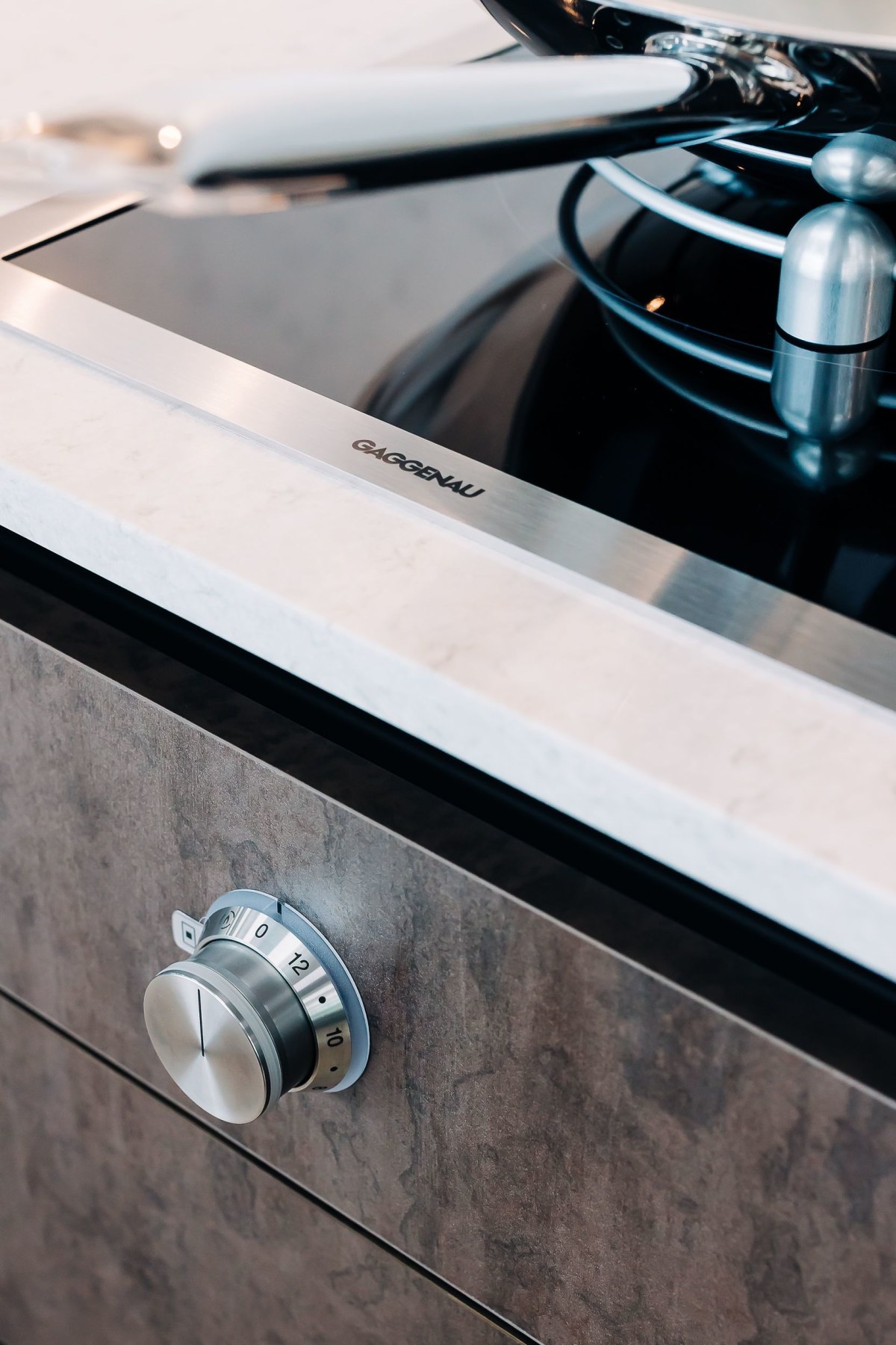 View across a white marble counter top in a Modern Classic style kitchen