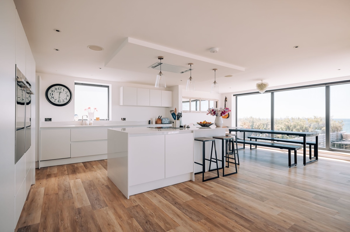 A white kitchen with island