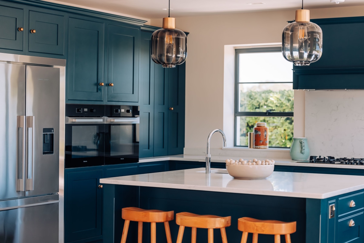 View across a white marble counter top in a Modern Classic style kitchen