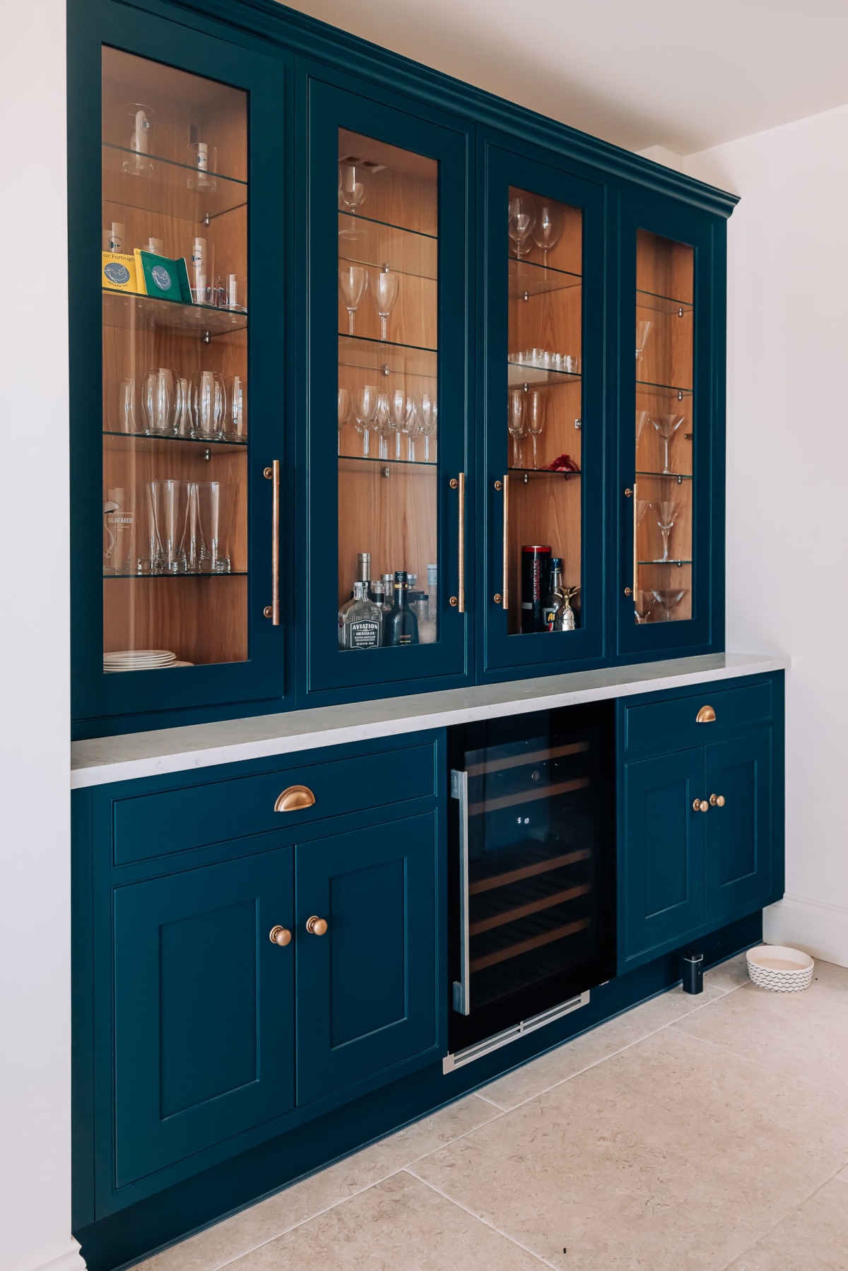 A Stoneham drinks cabinet and display in blue with oak inside