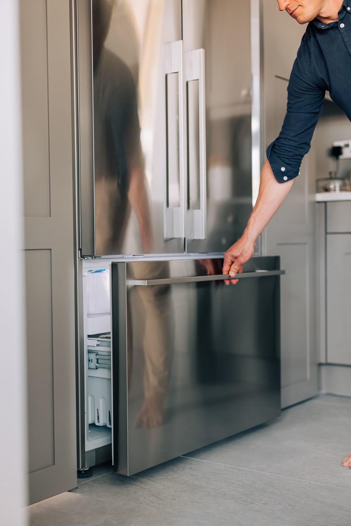 A french door american fridge freezer by Fisher and Paykel being opened