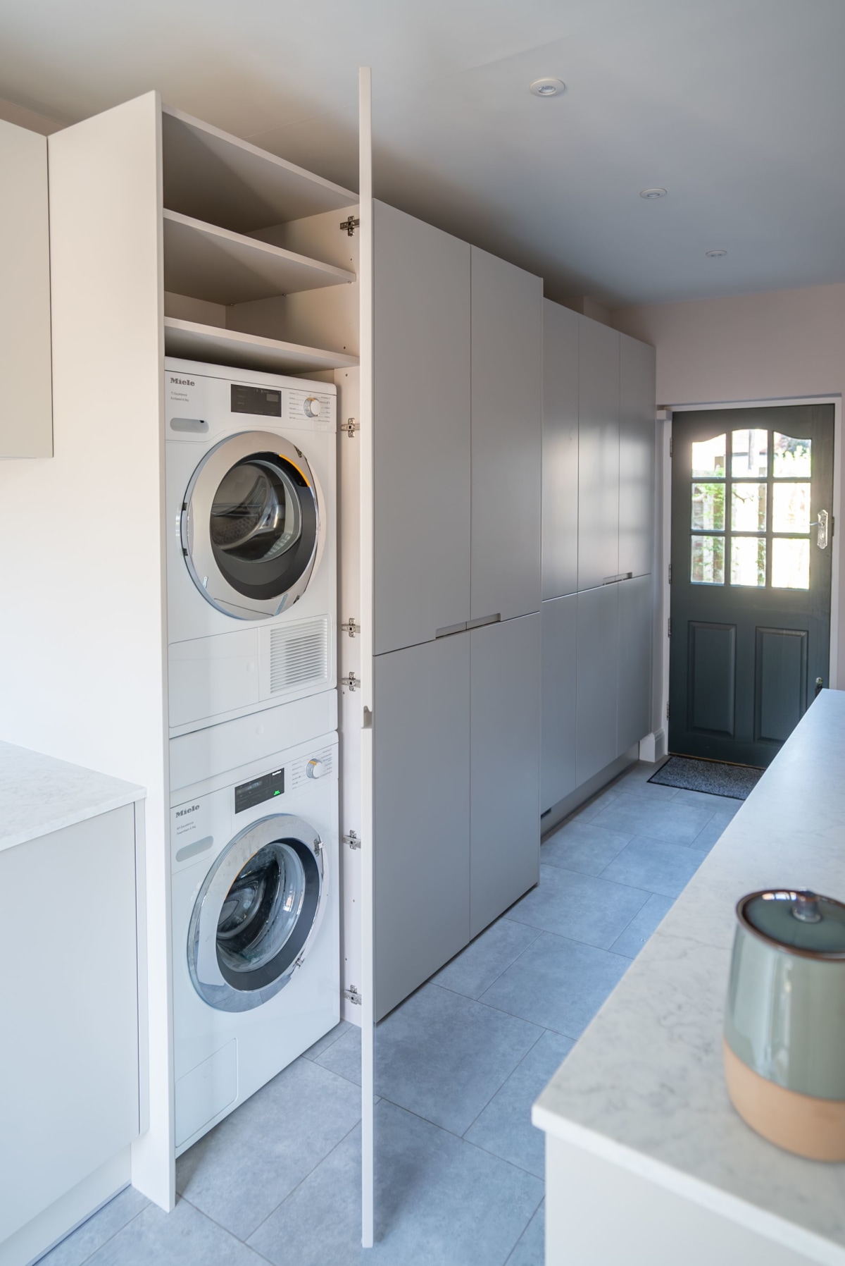 a washing machine and tumble dryer stacked on top of each other