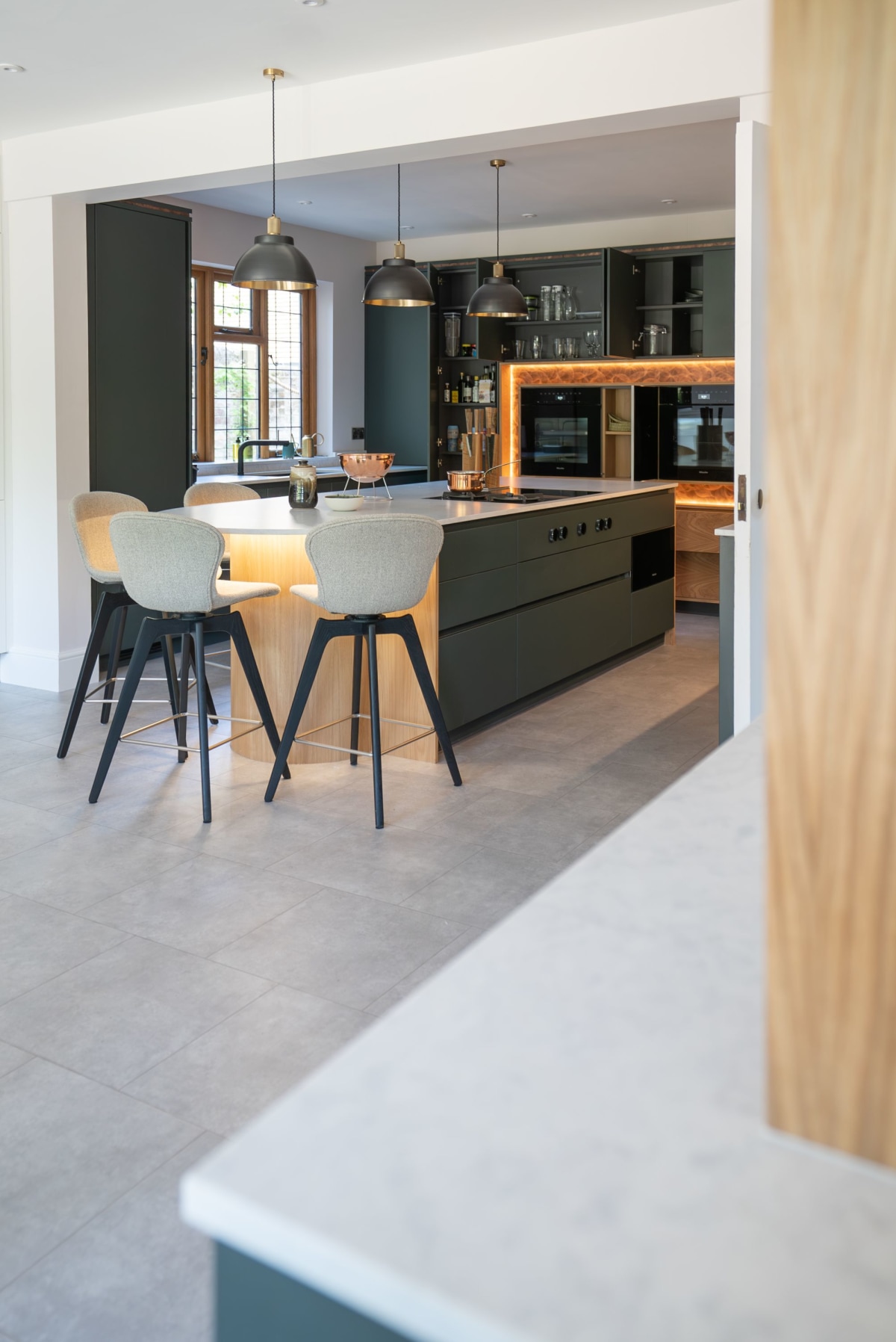 foreground worktop and background kitchen with stools