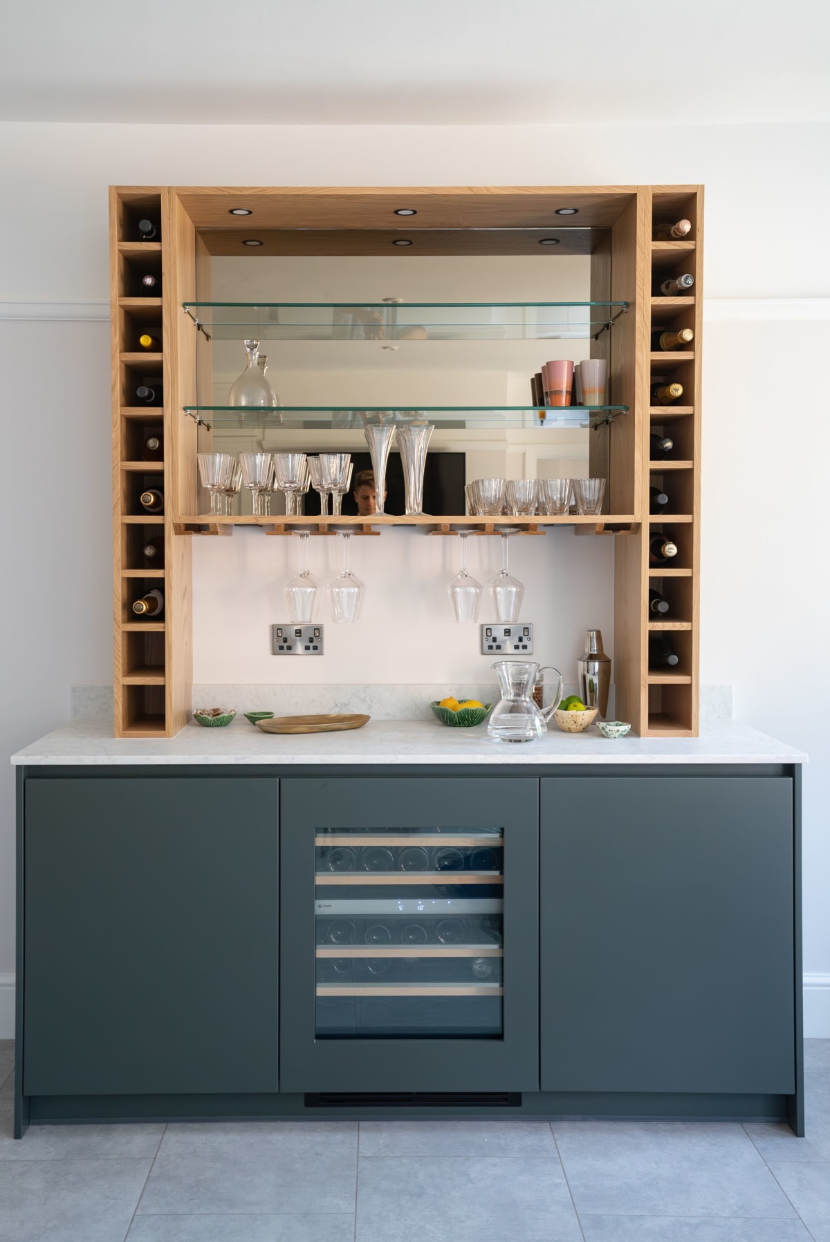 A bespoke drinks unit in vlue with quartz worktop and wine conditioning unit