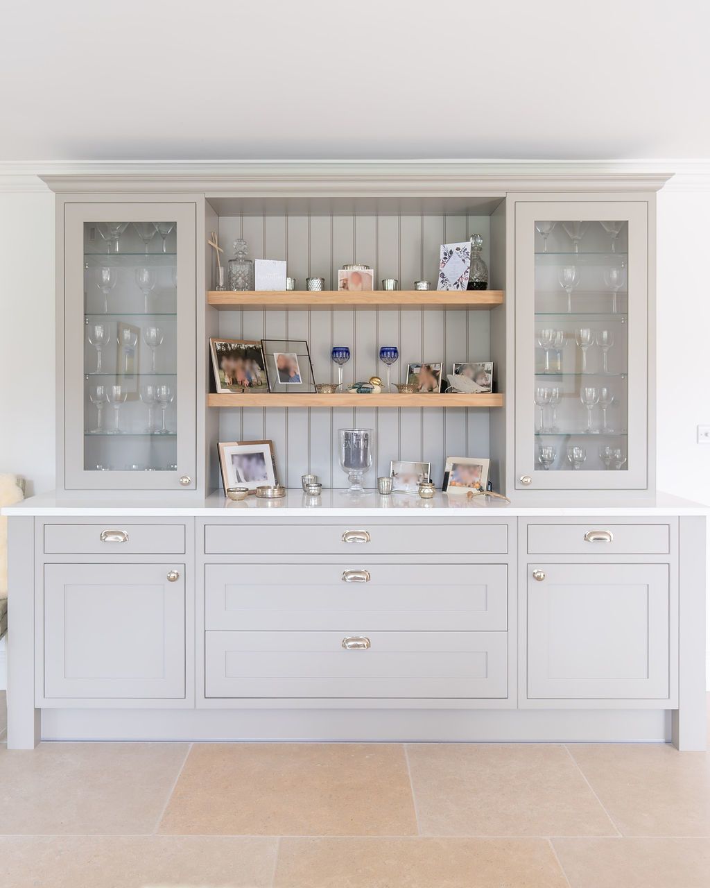 A stand alone dresser in light grey