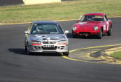 Kim Jacobs in her Proton Satria holding off a 1962 Lotus Elite