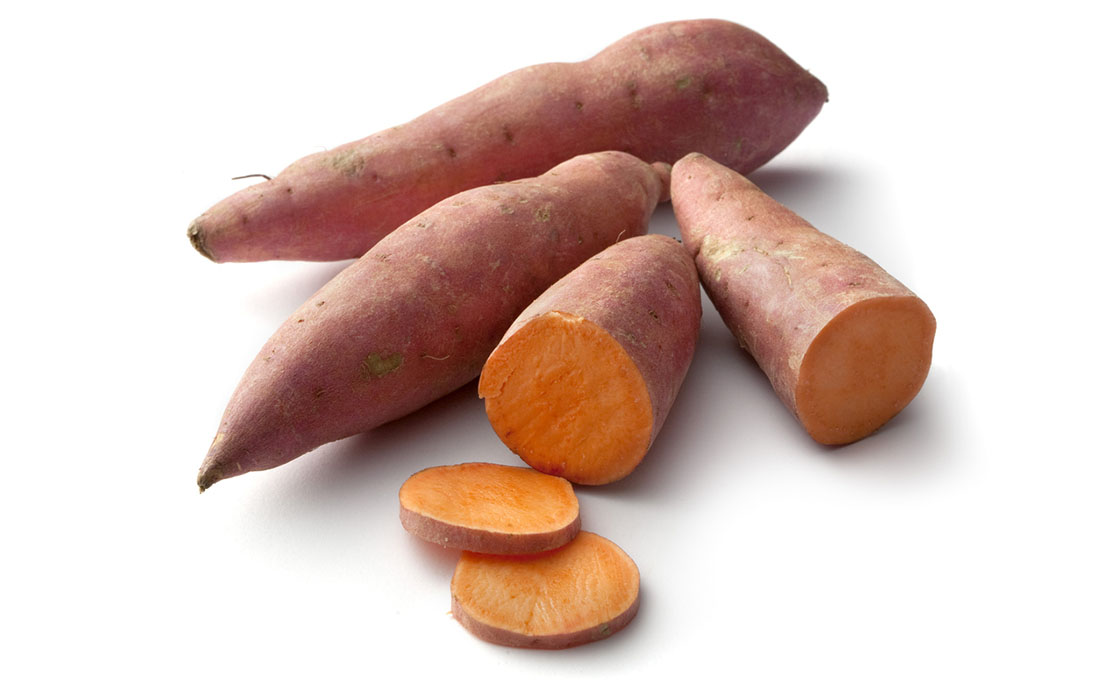 Raw sweet potato with some sliced pieces