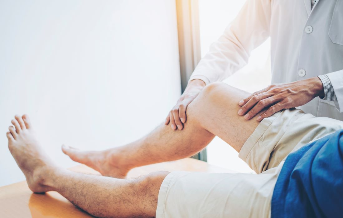 Physio treating an injured knee