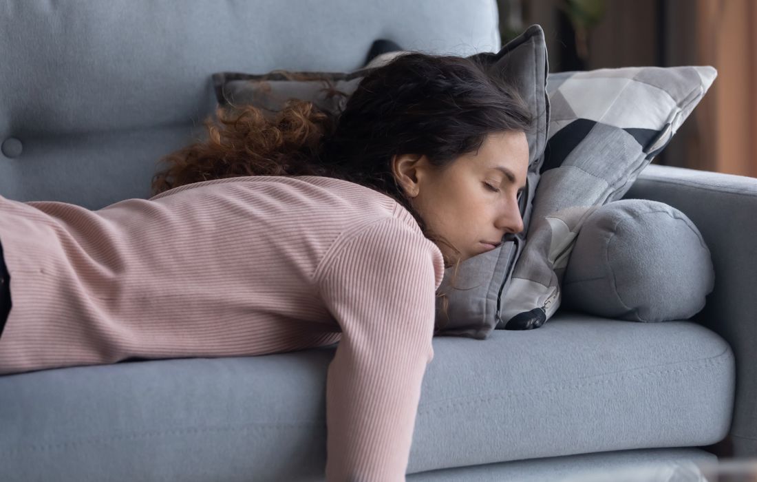 woman laying on couch