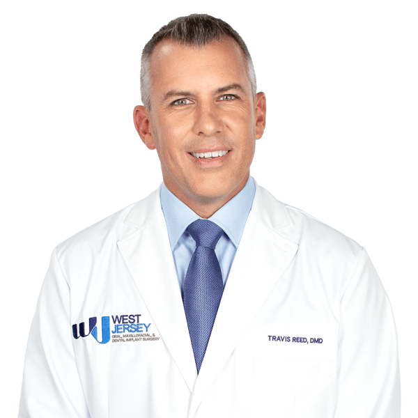 Professional photo of <br>Travis Reed, <br class='is-hidden-mobile'>DMD