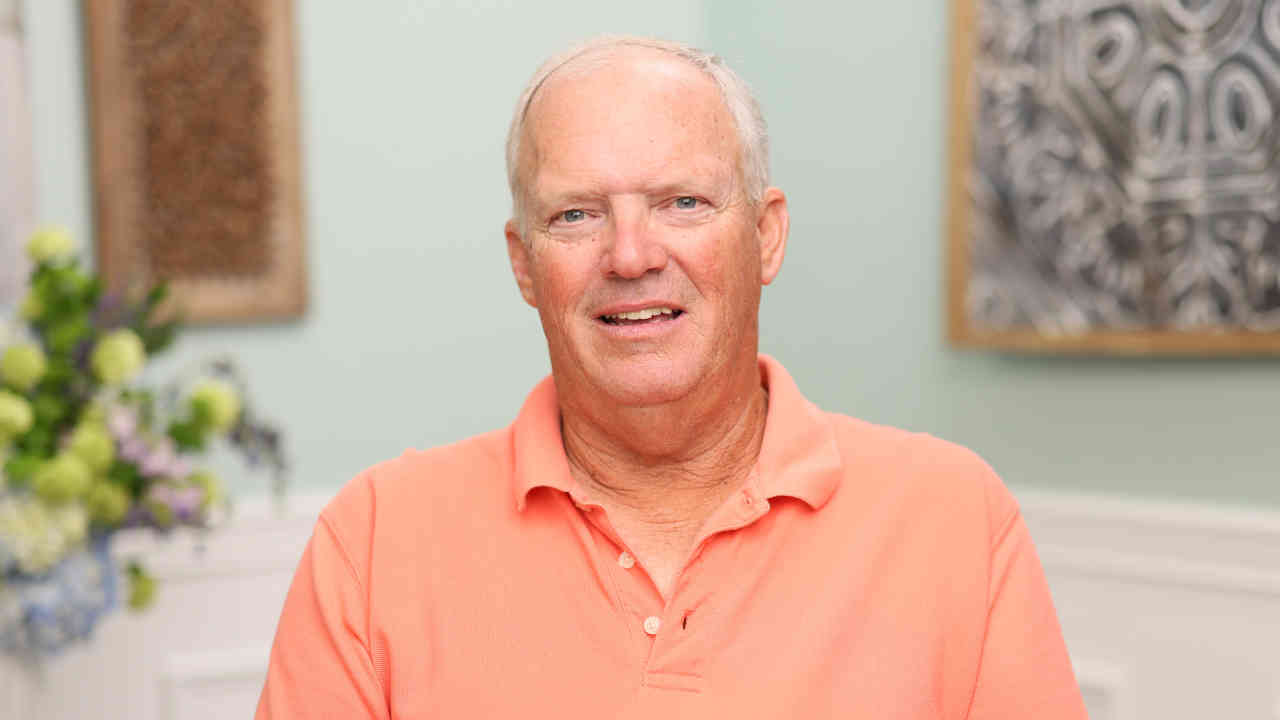portrait image of cliff after dental implants